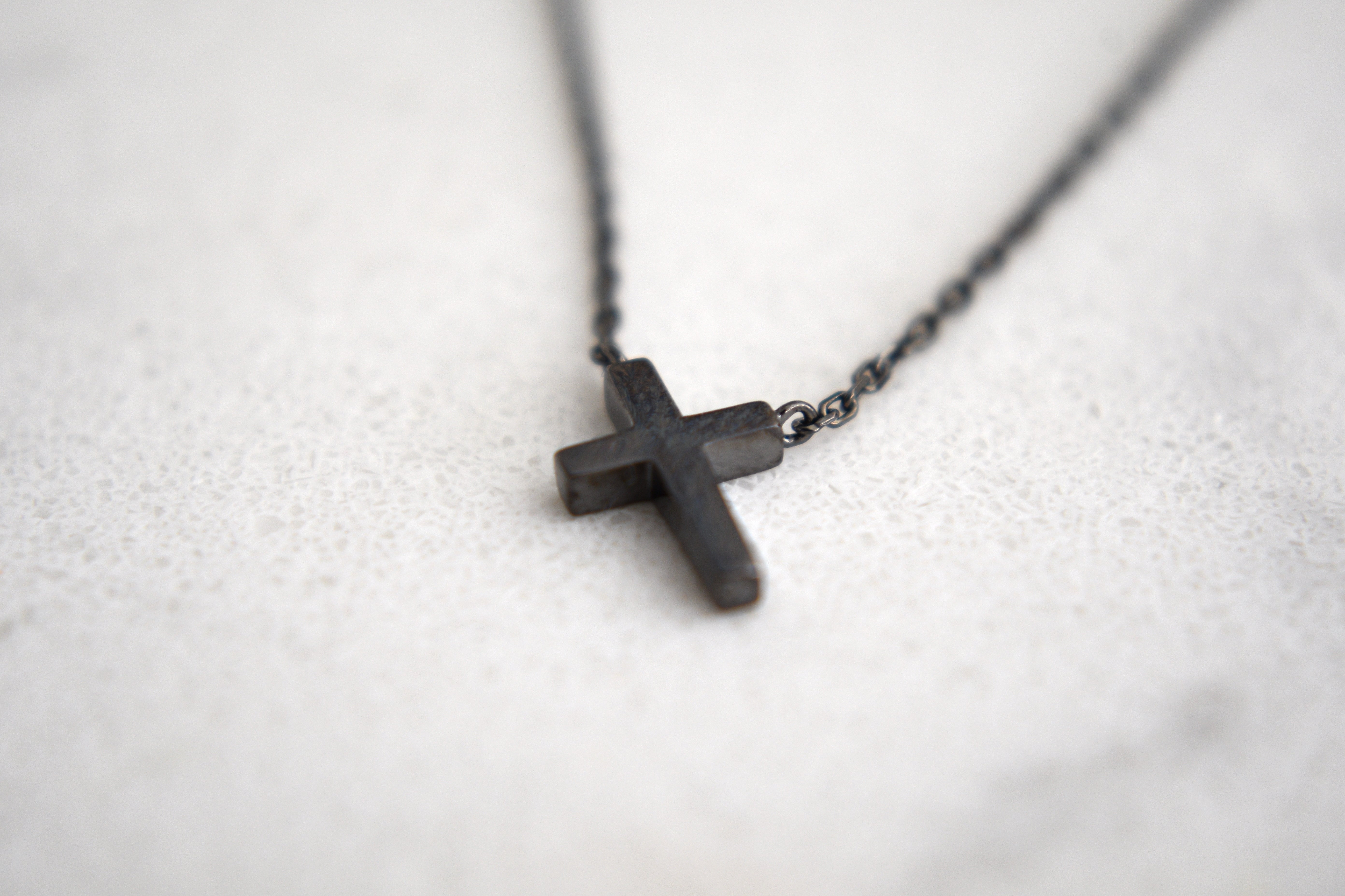 Alexis Leaning Cross Necklace in Black Gold Plating