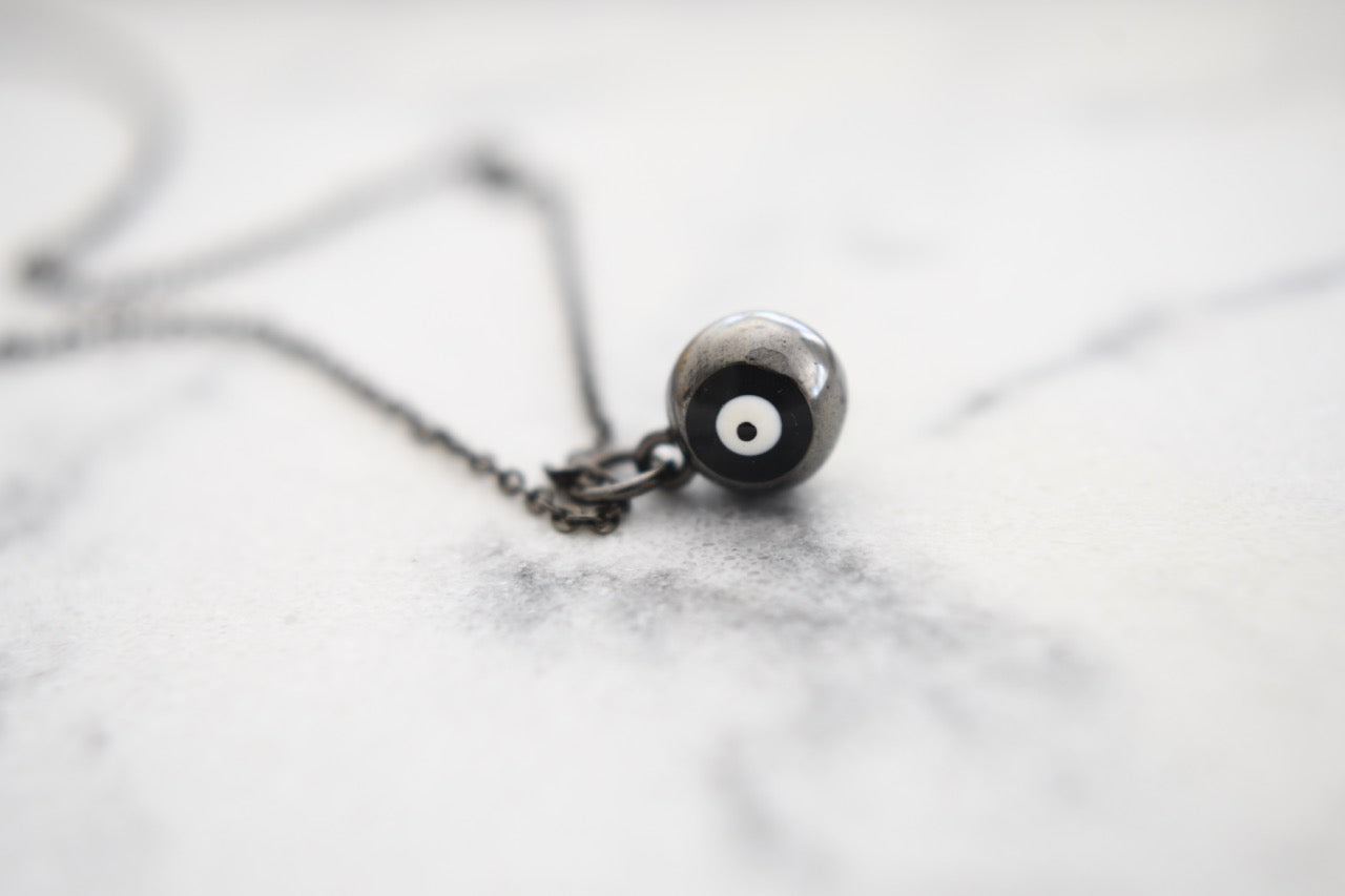 Cami Round Eye Necklace in Black Gold Plating