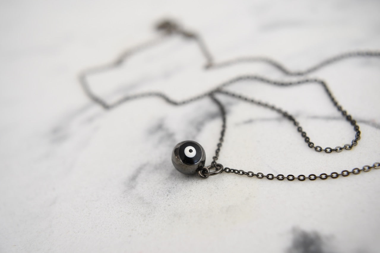 Cami Round Eye Necklace in Black Gold Plating